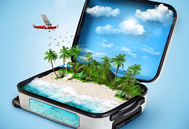 Open suitcase with a tropical island inside. Traveling