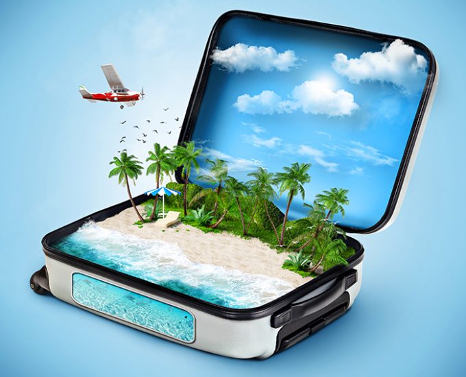 Open suitcase with a tropical island inside. Traveling