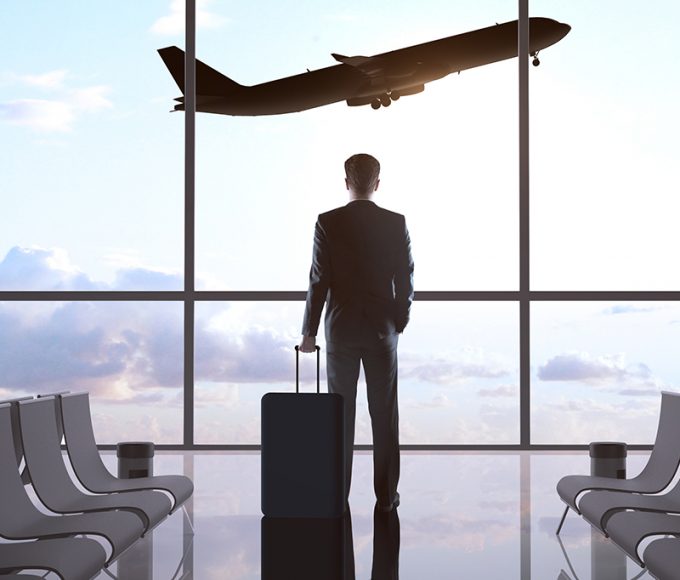 businessman in airport and airplane in sky