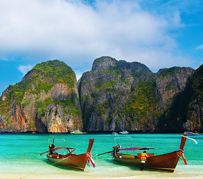 Tropical beach, traditional long tail boats, famous Maya Bay, Thailand